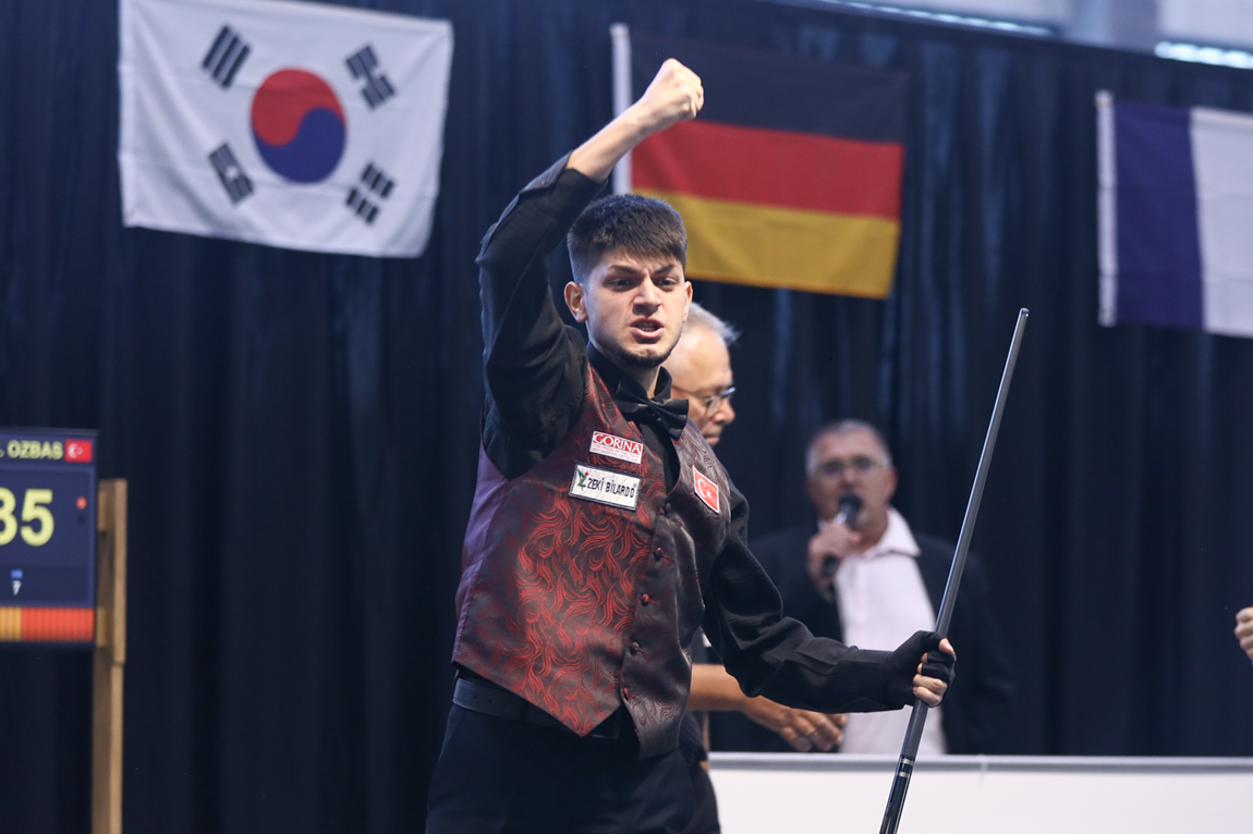 Seymen Ozbas carries the Turkish flag. 